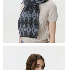 Detailed texture of Argyle knit scarf in grey and blue with soft wool-like finish