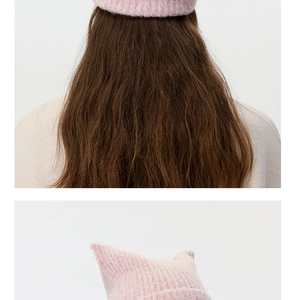 Detailed close-up showing pink wool blend knit texture and cute cat ear design of the beanie