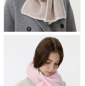 Detailed knit texture of pink wool blend scarves featuring ribbed weave patterns