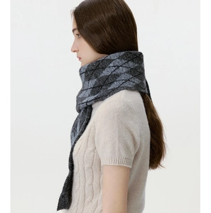 Detail of grey diamond lattice knit scarf with thick wool-like woven texture and pattern