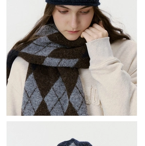 Close-up of classic argyle knit scarf and navy beanie set for winter warmth