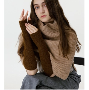 Detailed knit texture of dark brown fingerless long arm warmers for autumn and winter wear