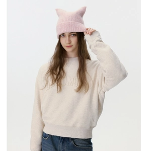 Pink cat ear wool blend knitted hat shown on model for a cute winter look