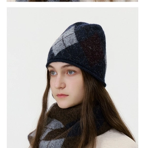 Detail of argyle knit beanie and matching scarf set with soft wool texture for winter