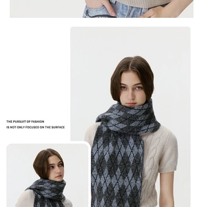 Detailed knit texture of argyle diamond pattern scarf in black and grey tones