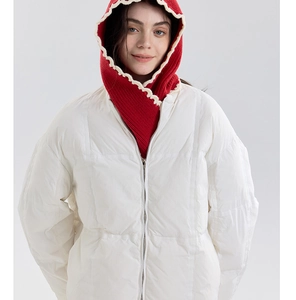 Detail of red knit balaclava with cream wavy trim under white down puffer jacket