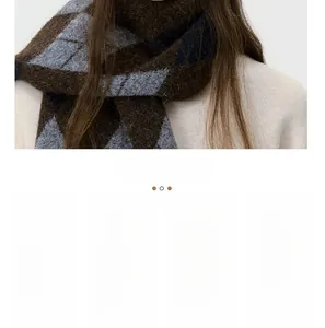 Detailed close-up of a warm knit scarf featuring a classic argyle plaid pattern in brown and grey