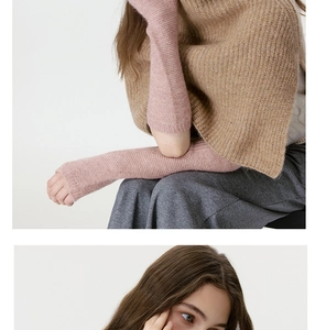 Detail of pink ribbed knit arm warmers made of soft high-quality yarn for winter warmth