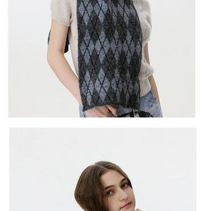 Detail of grey argyle knit scarf showing soft texture and premium diamond pattern