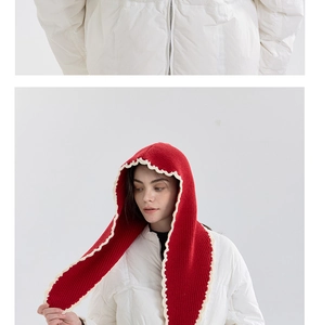 Detail of red knit balaclava hood with white wavy crochet trim and matching scarf tie
