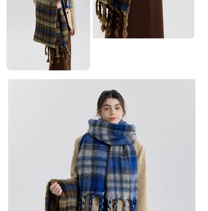 Detail shot of the soft thick plaid scarf texture with hand-knitted fringe tassels