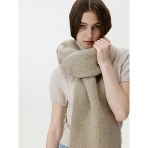 Minimalist wool blend beige fringe scarf with soft brushed texture worn by a model