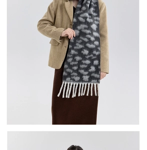Close-up of leopard print scarf featuring soft brushed texture and elegant fringe details