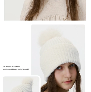 Three-angle views showing a white knitted beanie with a large fluffy pom-pom detail