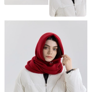 Detailed knit texture of red balaclava hood scarf with button and crossover design