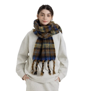 Thick mixed-color plaid scarf with chunky tassels in dark brown and navy tones