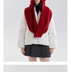 Front view of a red knitted balaclava hood paired with a white puffer jacket