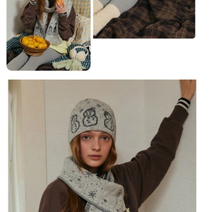 Detailed knit texture of wool blend beanie with cartoon snowman and snowflake patterns