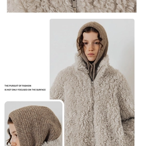 Detail showing plush cream teddy jacket texture and brown knit balaclava for winter wear