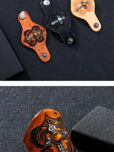 Macro detail of embossed leather rings with metal cross and tiger eye stone inlay