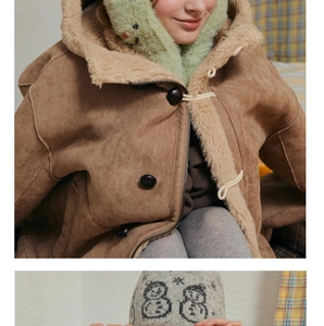 Detail of wool blend knit beanie with snowman jacquard and suede toggle coat