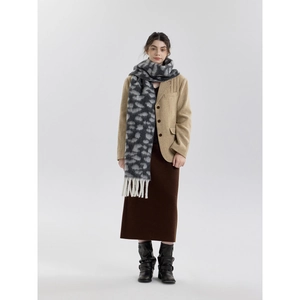 Fashionable leopard print scarf with tassels for winter, styled with a khaki wool blazer