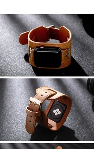 Detailed view of vintage brown leather wide cuff strap with silver buckle for Apple Watch