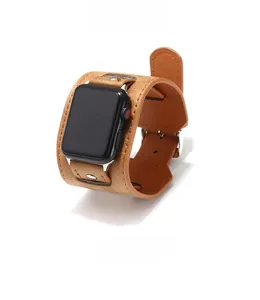 Detailed view of 4.5cm wide brown leather cuff strap with rivets for Apple Watch