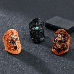 Vintage leather cross rings set with turquoise and tiger eye stones in retro punk style