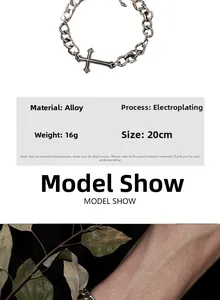 Detail of silver vintage Cuban chain bracelet with cross charm and electroplating texture
