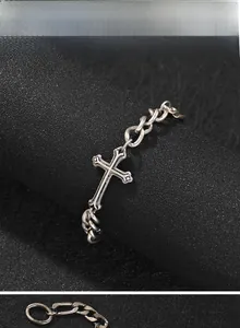 Detailed view of retro silver cross bracelet with vintage hip hop metal chain links