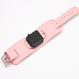 Pink leather wide cuff watch strap for Apple Watch with silver buckle and white background