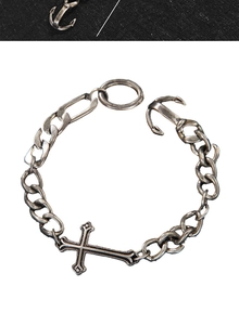 Detail showing vintage cross Cuban chain bracelet with anchor clasp in antique silver