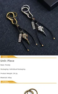 Macro detail of retro bird skull charms and alloy pendants on woven leather keychain