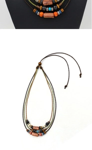 Detail of bohemian multilayer necklace with wooden beads and adjustable woven cord