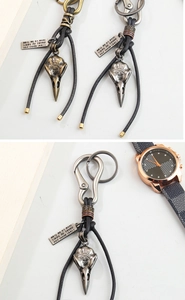 Detail of Viking bird skull keychain with Vegvisir compass and leather cord