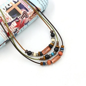 Retro Bohemian multilayer long necklace featuring handcrafted wood beads and ceramic charms