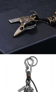Gothic raven skull keychain with Nordic runes, leather cord, and engraved metal quote tag