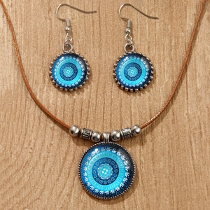Parure bohème avec pendentifs mandala éléphant sur collier tressé marron et boucles d'oreilles