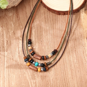 Three-layer bohemian multi-strand necklace with natural wooden beads and turquoise accents