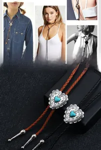 Detail of western punk heart bolo tie with blue turquoise and woven leather cord