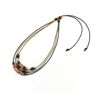 Handmade Bohemian multilayer wooden bead necklace with tribal woven cords and turquoise accents