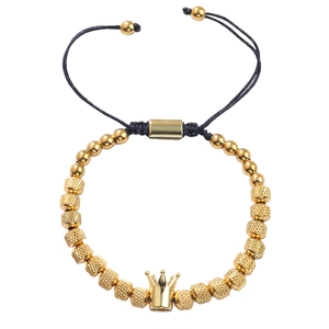 Bracciale vintage con perle dorate e corona con cordino nero intrecciato regolabile