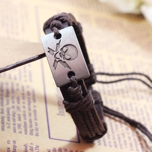 Punk leather woven bracelet featuring a vintage skull and lightning metal plate