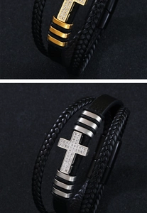 Close-up of woven leather bracelet with cz-inlaid cross in gold and silver finish