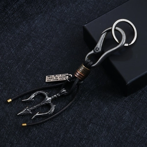 Vintage trident keychain with woven leather strap and inspirational metal tag pendant