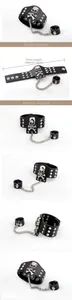 Detail view of black leather punk skull bracelet with silver rivets and ring link