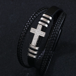 Cross charm bracelet with PU leather weave and zircon accents in silver and black