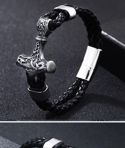 Macro detail of Viking Mjolnir bracelet showing Celtic knotwork and magnetic buckle