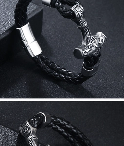 Macro shot of Viking Thor's Hammer Mjölnir bracelet with woven leather and antique metalwork